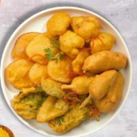 Pakora Darling · Assorted vegetables dipped in a light batter and fried until golden brown.