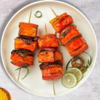 Knock On Tandoori Paneer · Fresh cubes of cottage cheese marinated in yoghurt and baked in a tandoor clay oven.
