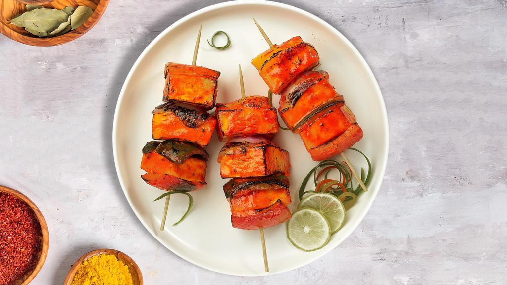 Knock On Tandoori Paneer · Fresh cubes of cottage cheese marinated in yoghurt and baked in a tandoor clay oven.