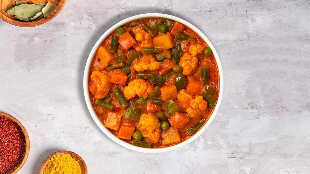 Mixed Vegetable Feast · Seasoned fresh vegetables cooked in a tomato & onion gravy.