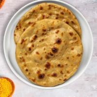 Tandoori Roti Rollout · Whole wheat Indian bread cooked in a clay oven.
