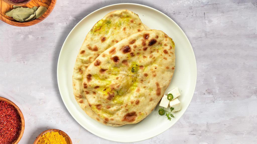 Paneer Naan Pitcher · Freshly baked bread stuffed with cottage cheese cooked in a clay oven.