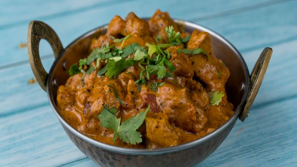 Chicken Curry · Boneless chicken cooked in a spicy flavored sauce.