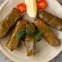 Stuffed Grape Leaves (5 Pieces) · Most popular. Grape leaves stuffed with rice, pine nuts, fresh parsley, mint, and current.