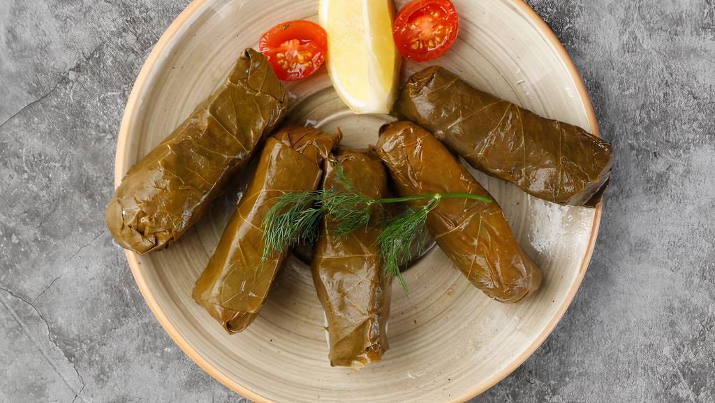 Stuffed Grape Leaves (5 Pieces) · Most popular. Grape leaves stuffed with rice, pine nuts, fresh parsley, mint, and current.
