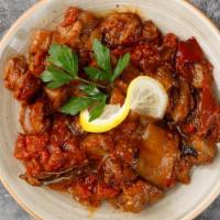 Eggplant With Tomato Sauce · A small piece of eggplant in a moderately spicy sauce of fresh tomatoes, green peppers, onio...
