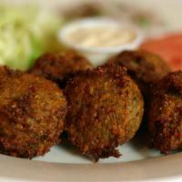Falafel Appetizer · Most popular. Serve six pieces. Mashed chickpeas mixed with celery, parsley, onions, garlic ...