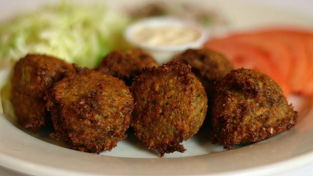 Falafel Appetizer · Most popular. Serve six pieces. Mashed chickpeas mixed with celery, parsley, onions, garlic and herbs. Served with tahini sauce.