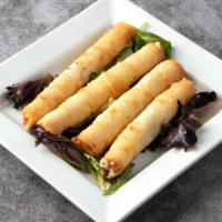 Cheese Pastry Roll · Serve five pieces. Deep fried filo dough rolled with Feta cheese and parsley stuffing.