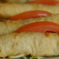 Spinach Pastry Roll · Serve five pieces. Deep fried filo dough rolled with spinach, onions, Mozzarella and Feta ch...