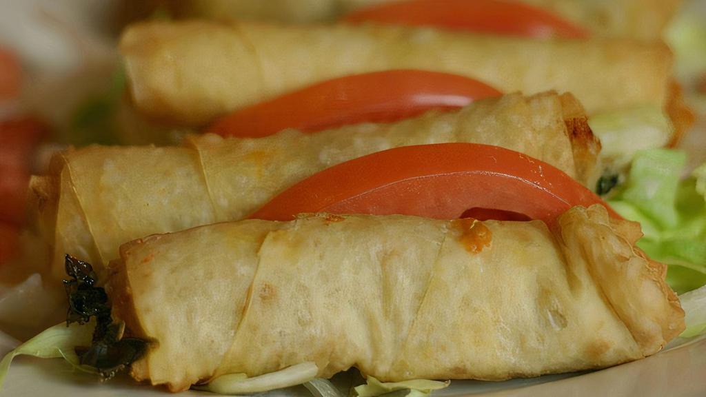 Spinach Pastry Roll · Serve five pieces. Deep fried filo dough rolled with spinach, onions, Mozzarella and Feta cheese.