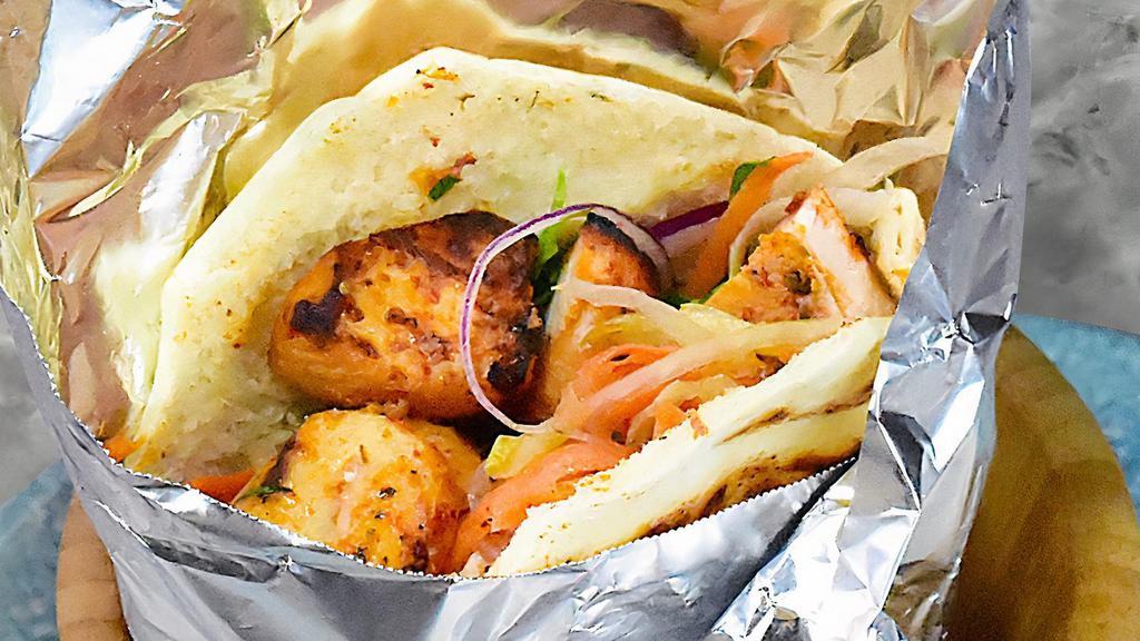 Chicken Shish Kebab · Most popular. Served with lettuce, tomatoes, marinated red cabbage, onions and hot and white sauces.