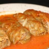 Stuffed Cabbage · Boiled cabbage leaves filled with a mixture of ground lamb, beef, rice, and herbs. Served wi...