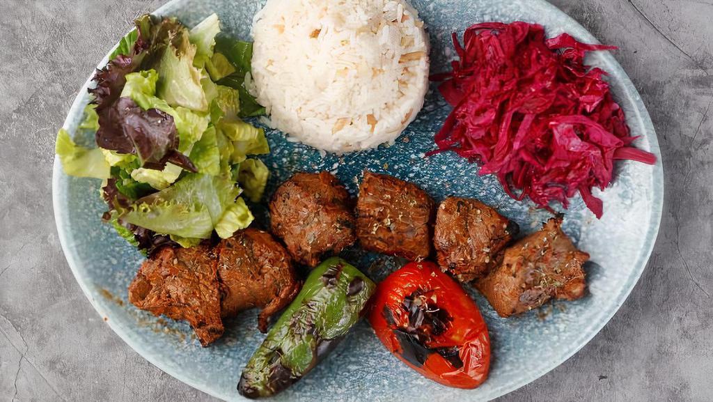 Lamb Shish Kebab · Most popular. Specially marinated cubes of lamb grilled to delight on skewers. Served with rice, peppers and onions, lettuce and a side of red and white sauces.