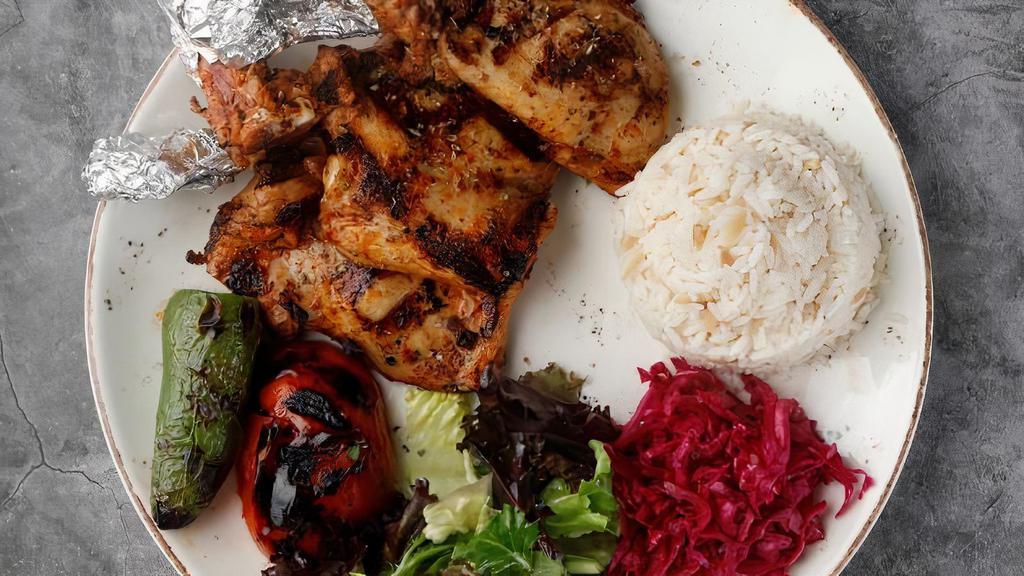 Chicken Chops · Marinated chicken thighs grilled on char-grill. Served with rice mixed salad, marinated red cabbage, red and white sauce and bread.