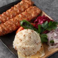 Chicken Adana · Chopped chicken grilled on skewers and flavored with red bell peppers. Served with rice mixe...