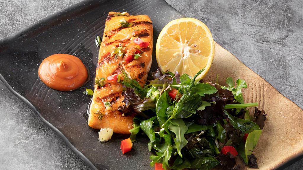 Salmon Steak · Chunks of char-grilled salmon served with choice of mixed green salad or rice.