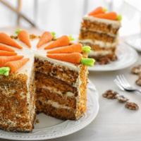 Carrot Cake · Sweet and moist carrot cake, full of cut carrots and toasted nuts.