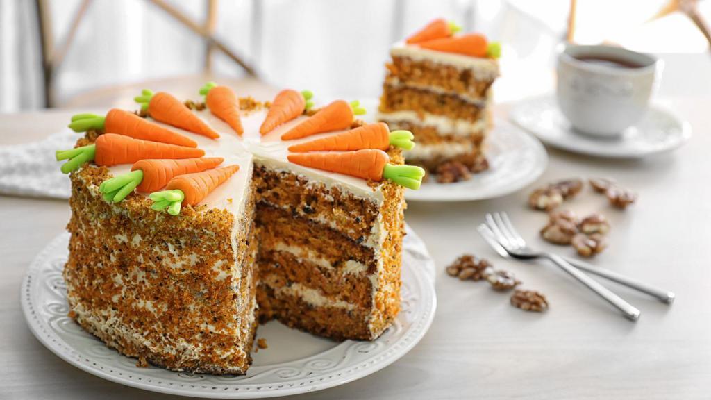 Carrot Cake · Sweet and moist carrot cake, full of cut carrots and toasted nuts.