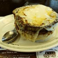 Crock Of French Onion Soup · Rich broth topped with croutons and mozzarella cheese, baked golden brown.