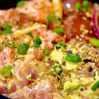 Poke Bowl · Delicious poke mixed in our house sauces