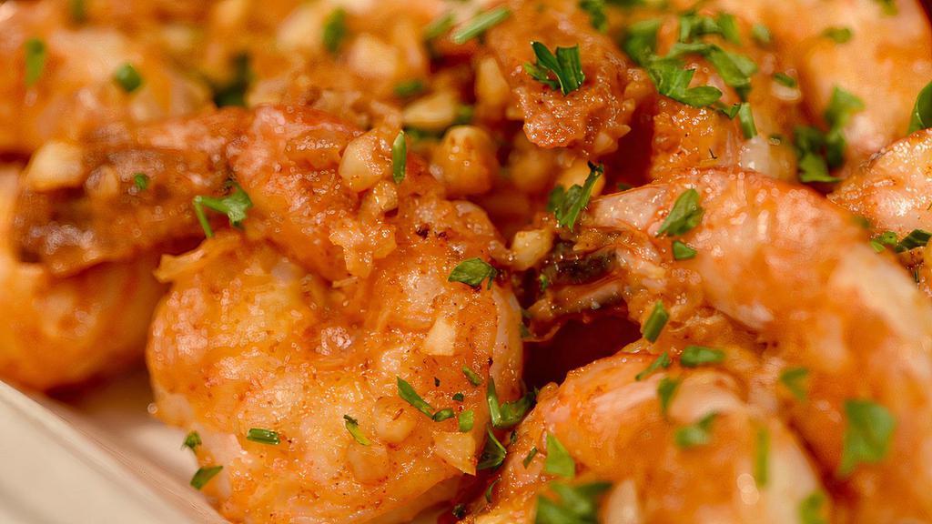 Spicy Garlic Shrimp (Regular) · Pan seared shrimp in our house garlic sauce.  Served with three Sides.