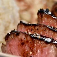 Teriyaki Steak (Regular) · Top sirloin grilled and glazed with our secret scratch teriyaki sauce.  Served with three Si...
