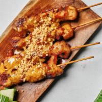 Chicken Skewers With Peanut Sauce · 4 grilled chicken skewers marinated with spicy peanut sauce.
