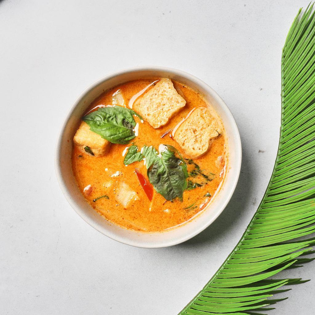 Thai Coconut Soup · Rich and creamy yet tangy and savory thai coconut chicken soup made with tomato, mushroom, onion, and red pepper.
