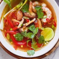 Tom Yum Soup · Rich, tangy and savory thai chicken soup made with tomato, mushroom, onion, and red pepper.