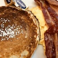 The Lumberjack · Two buttermilk pancakes, two eggs any style and your choice of bacon, ham or sausage.