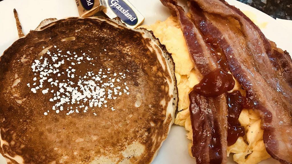 The Lumberjack · Two buttermilk pancakes, two eggs any style and your choice of bacon, ham or sausage.