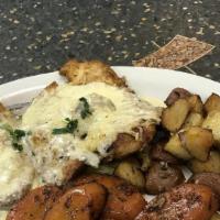 Parmesan Crusted Chicken · Parmesan crusted chicken breast, pan seared and served with sage butter sauce, roasted new p...