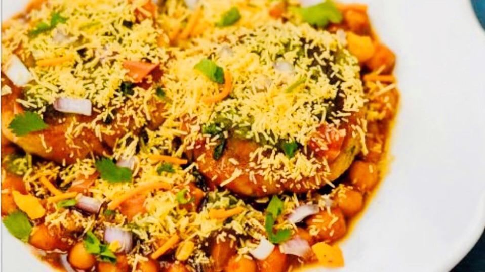 Aloo Tikki Chaat · Crispy Potato Patties,Chick Peas,(Chhole), Green chutney ,Dates & Tamarind Chutney.