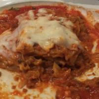 Beef Lasagna · Layers of pasta with fresh ground beef, ricotta, Parmesan and mozzarella cheeses in our own ...