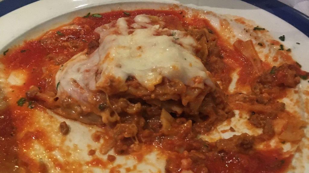 Beef Lasagna · Layers of pasta with fresh ground beef, ricotta, Parmesan and mozzarella cheeses in our own tomato sauce.