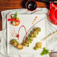 Cherry Blossom Roll · Shrimp tempura and avocado inside, topped with spicy crab, salad, and seaweed salad.