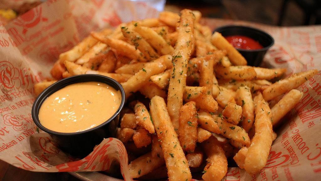 Parmesan Truffle Fries · Topped with truffle oil, garlic, chopped parsley, parmesan. cheese, and served with spicy mayo and ketchup.