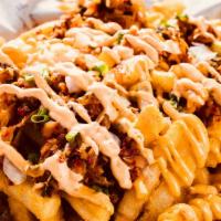 Kimchi Fries · Deep fried fries topped with onion, kimchi, scallion, and spicy. mayo on the top