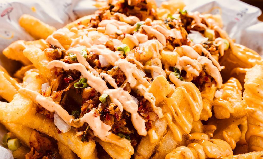 Kimchi Fries · Deep fried fries topped with onion, kimchi, scallion on the top. and spicy mayo on the side.