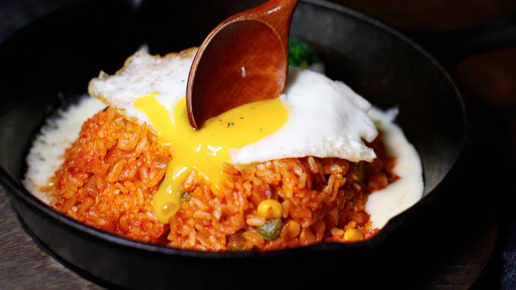  Kimchi Fried Rice · Pan- fried white rice with kimchi, ham, vegetables. and sunnyside egg