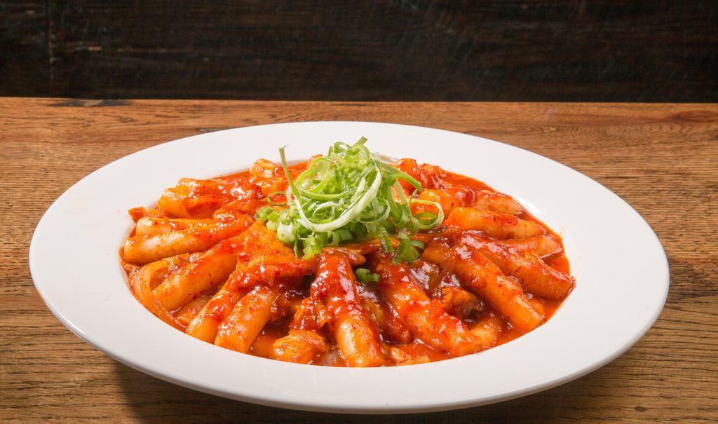 Tteok-Bokki · A popular Korean snack food made from soft rice cake, fish. cake and sweet red chili sauce. Braised rice cake, fish cake. scallion, onion, cabage with our special spicy sauce.