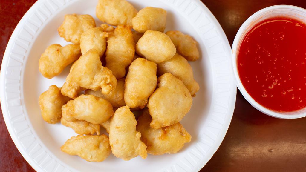 Sweet And Sour Chicken / 甜酸雞 · Served with chicken fried rice or roast pork fried rice and egg roll or soda. / 附雞炒飯或叉燒炒飯及蛋卷或汽水.