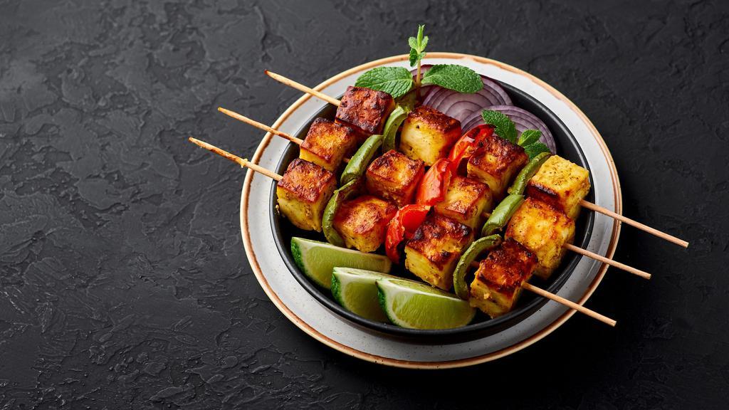 Paneer Tikka · Gluten-free. Cottage cheese, bell pepper, marinated in yogurt, and spices.