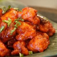 Chilli Chicken · Tender chicken cooked in a spicy onion, bell pepper and soy sauce.