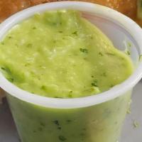 Chin Chin 2 Oz (Green Sauce) · Our famous signature green sauce. A flavorful blend of cilantro, onions, and jalapeños.