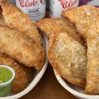 Empanadas · Crispy flour savory pastries stuffed with a variety of different meats, veggies, or cheese.