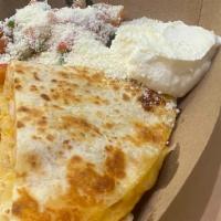 Cheese Quesadilla · Served in flour tortilla with Mexican cheese, sour cream, pico de gallo and cotija cheese.