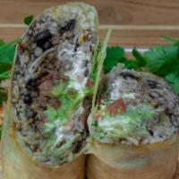 Brisket Burrito · Served with Mexican rice, guacamole, beans, cheese, sour cream and pico de gallo.