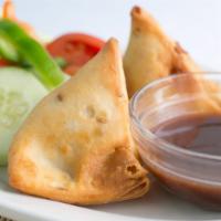Vegetable Samosa · Turnovers filled with potatoes, peas and mild spices.